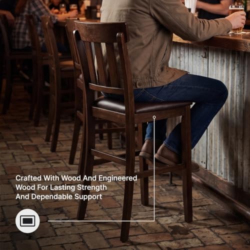 Signature Design by Ashley Haddigan Upholstered Barstool, 2 Count, Slat Back Design, Cushioned Seat, Wood, 25.5" H, Dark Brown | Easy-clean faux leather cushioned seat, Casual farmhouse wood slat back design, 25.6-inch seat height for kitchen islands - co